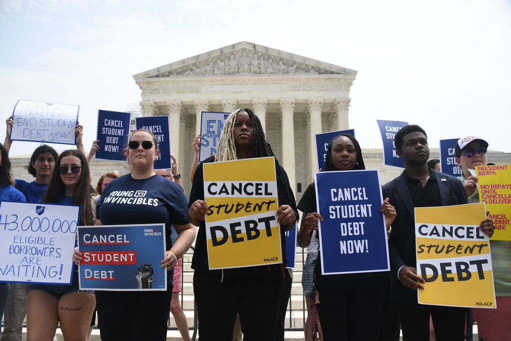 Supporters of student debt forgiveness demonstrate outside the US supreme court on Friday. Photograph: Olivier Douliery/ AFP