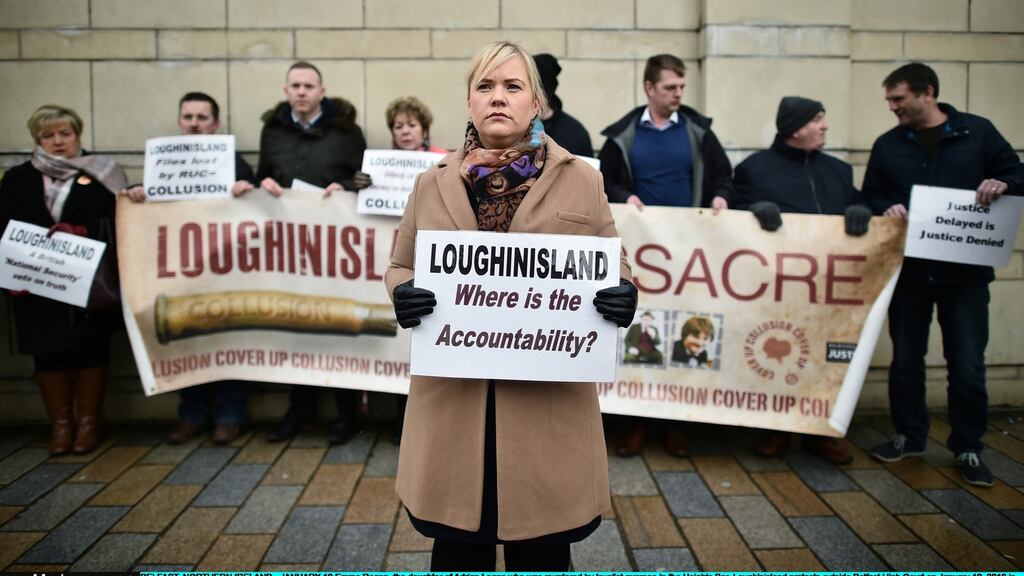 Emma Rogan, the daughter of Adrian Logan who was murdered by loyalist gunmen in the Heights Bar, Loughinisland protests outside Belfast High Court on January 19th, 2018. Photograph: Charles McQuillan/Getty Images