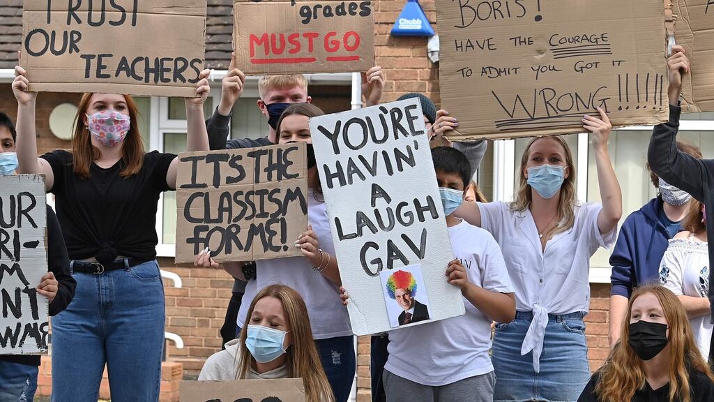 Students hold placards as they take part in a protest march to the constituency office of Gavin Williamson, Britain’s education secretary, to demonstrate against the downgrading of A-level results. Photograph: Paul Ellis / AFP