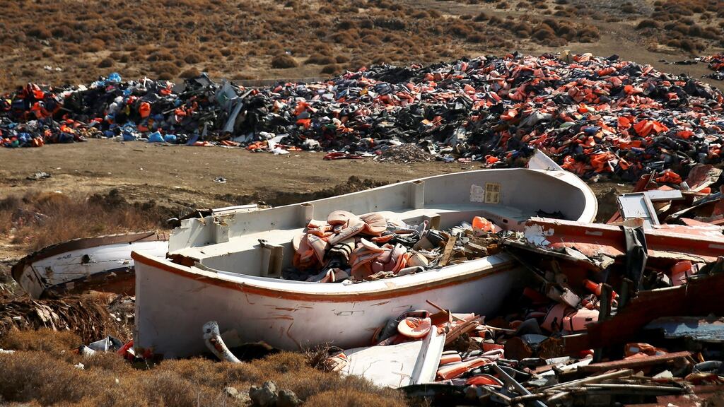 Lifejackets inside a wrecked boat used by refugees and migrants to cross part of the Aegean Sea from Turkey to Greece at a garbage dump site on the island of Lesbos. Photograph: Alkis Konstantinidis/Reuters