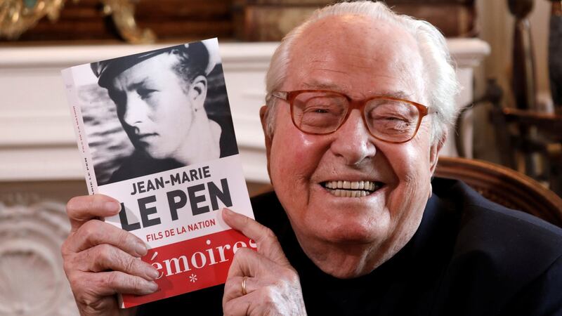 Jean-Marie Le Pen, founder of France’s far-right National Front political party, holds his book of memoirs in Montrerout, France. Photograph: Charles Platiau/Reuters