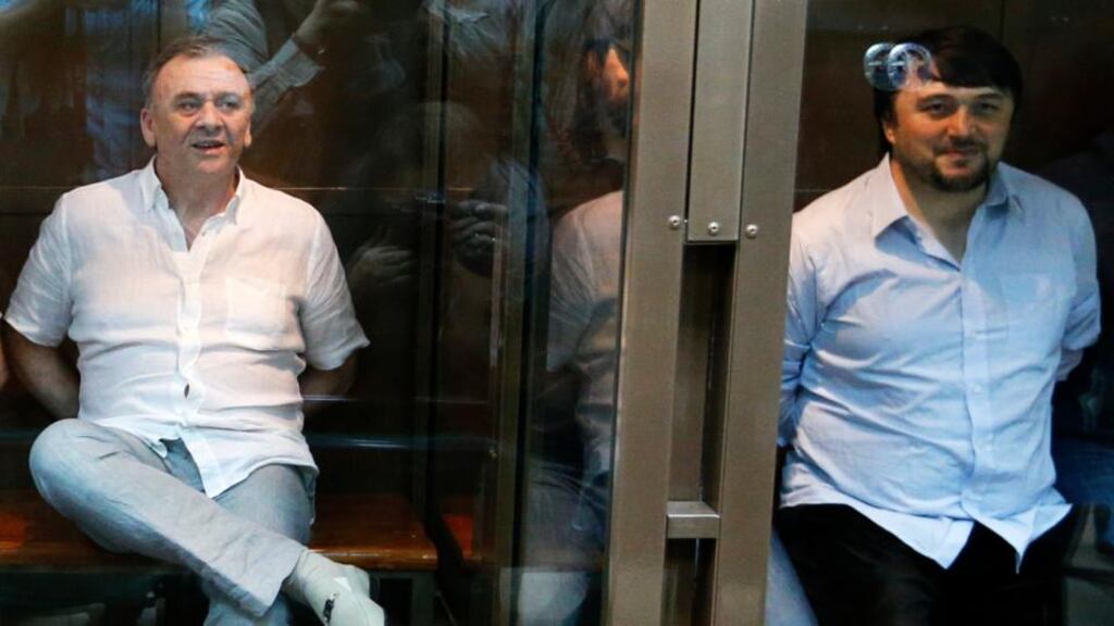 Defendants in the murder trial of Russian journalist and human rights activist Anna Politkovskaya, Lom-Ali Gaitukayev (left) and Rustam Makhmoudov (right) attend a court hearing in Moscow today. A Moscow court has sentenced the two men to life in prison for killing Anna Politkovskaya, an investigative journalist whose murder in 2006 raised international alarm over the risks faced by Kremlin critics in Russia, Interfax reported. Photograph: Sergei Karpukhin/Reuters