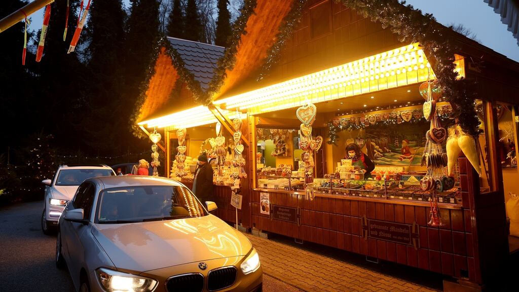 Customers sitting in their cars receiving goods at a drive-in Christmas market during the second wave of the coronavirus pandemic in Landshut, Germany. Photograph: Getty