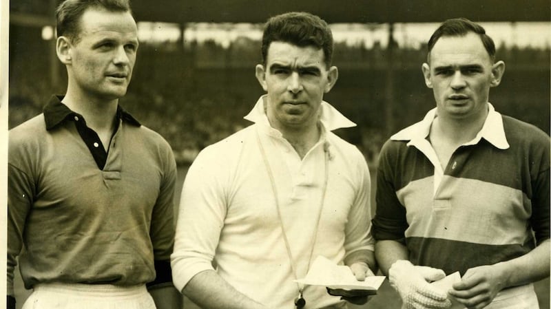Down captain Kevin Mussen and Kerry captain Paudie Sheehy with the referee before the game