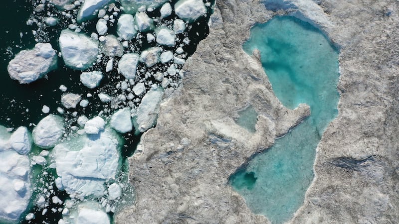 Melting ice forms a lake on free-floating ice jammed into the Ilulissat Icefjord during unseasonably warm weather near Ilulissat, Greenland. Photograph: Sean Gallup/Getty