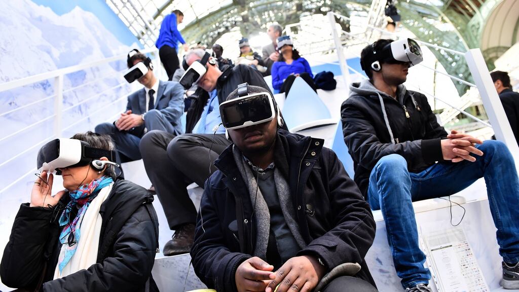Testing virtual reality headsets. Photograph: Loic Venance/AFP/Getty Images