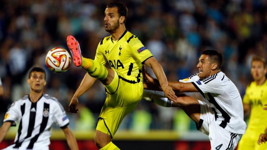 Tottenham Hotspur’s Roberto Soldado receives the ball while being guarded by Partizan Belgrade’s Miroslav Vulicevic (right). Photograph: AP Photo/Marko Drobnjakovic