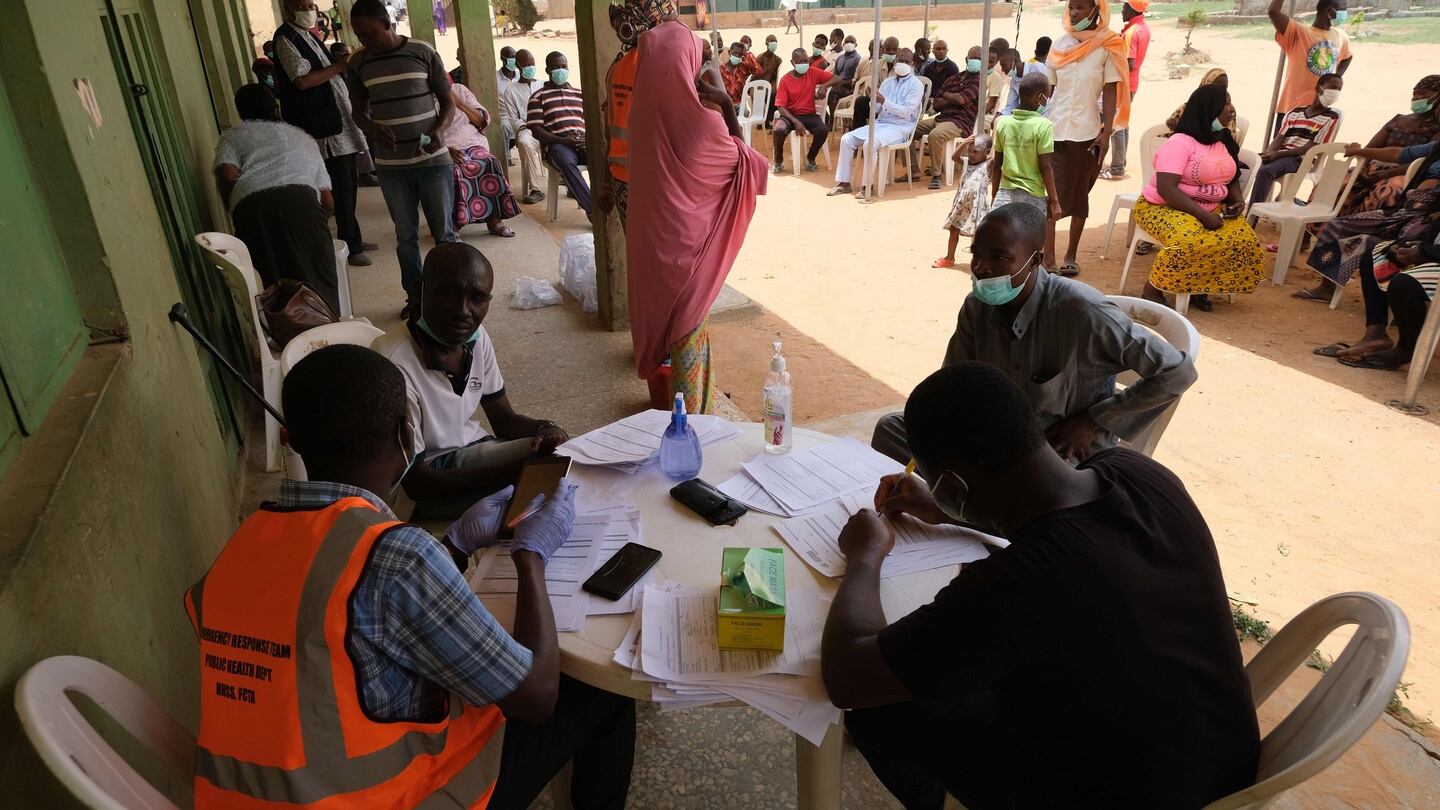 Health workers attend to people during a community Covid-19 coronavirus testing campaign in Abuja, Nigeria. The government there has commenced search and sample collections of eligible cases as they struggle to contain the pandemic with cases rising. File photograph: Getty Images
