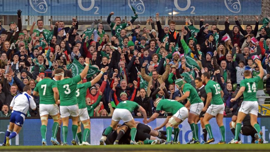 Ireland supporters rise to their feet as Conor Murray scores the first try for Ireland at the Aviva Stadium. Photograph: Eric Luke / The Irish Times