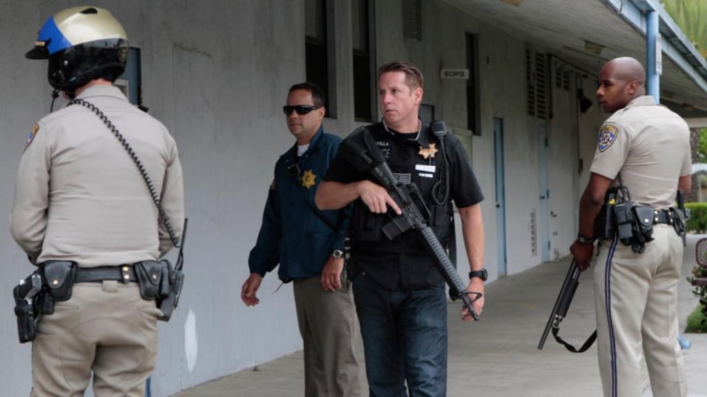 Police officers search the campus of Santa Monica College following yesterday’s shootings. Photograph: Jonathan Alcorn/Reuters