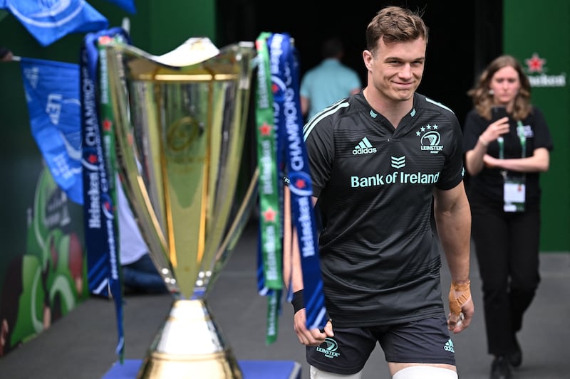 Leinster flanker Josh van der Flier walks past the Champions Cup trophy ahead of the captain's run at the Aviava Stadium. Photograph: Paul Ellis/AFP via Getty Images