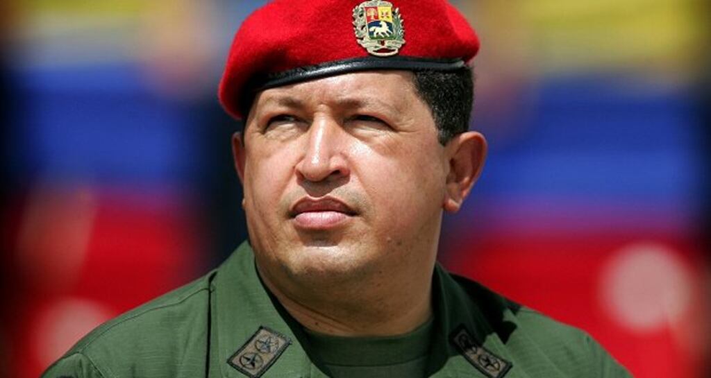 Venezuela's president Hugo Chávez wears an army uniform and the red beret of his parachute regiment at a military parade in Caracas in 2005. Photograph: Reuters