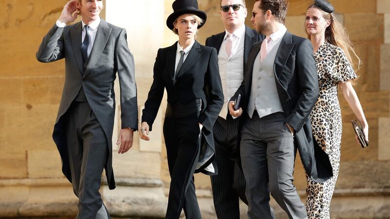 British model Cara Delevingne (second left) arrives to attend the wedding of Britain’s Princess Eugenie of York to Jack Brooksbank. Photograph: Getty
