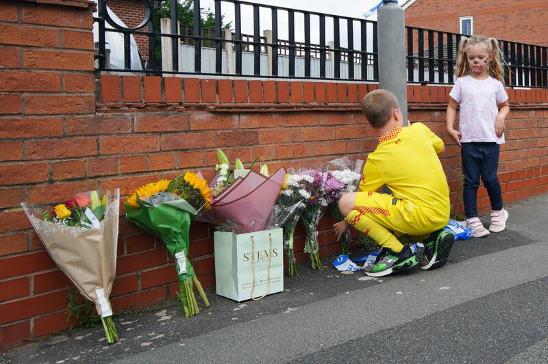 Children leave flowers near the scene in Kingsheath Avenue, Knotty Ash, Liverpool, where nine-year-old Olivia Pratt-Korbel wasn fatally shot. Photograph: Peter Byrne/PA Wire