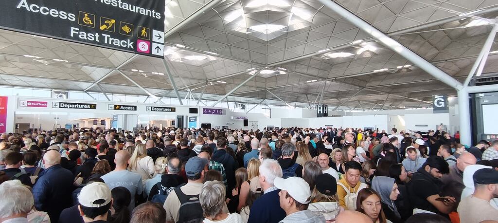 Passengers at Stansted Airport on Sunday morning as some of the airport's systems experienced a malfunction. Photograph: Jonathan Goodacre/PA Wire