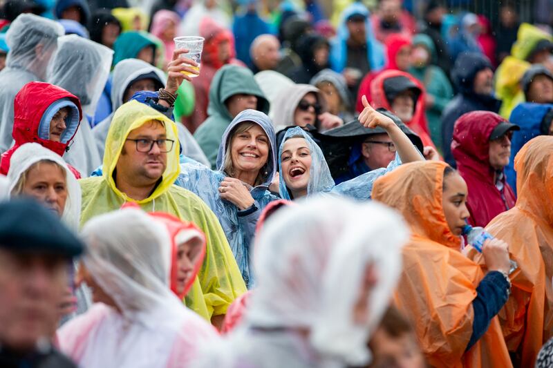 Joy amid the deluge at the concert. Photograph: Tom Honan/The Irish Times