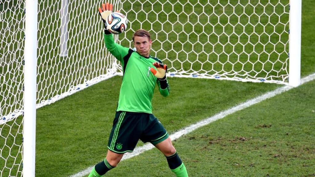 Goalkeeper Manuel Neuer of Germany saves a shot from France’s Karim Benzema of France during their World Cup quarter-final at Estadio do Maracana in Rio de Janeiro, Brazil. Photograph: Marcus Brandt/EPA
