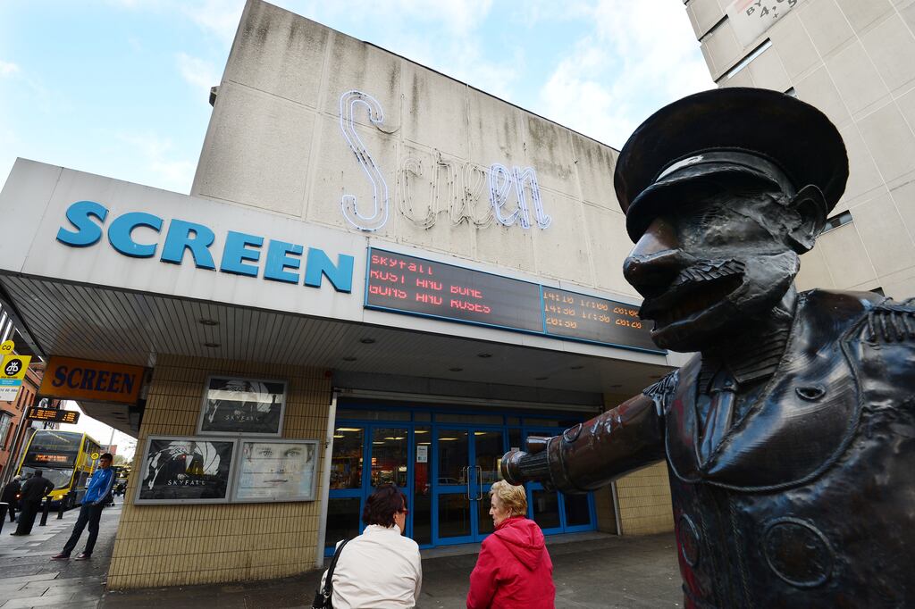 The Screen Cinema, which once stood on the corner of Hawkins Street and Townsend Street, guarded by the sculpture of Mr Screen. Photograph:  Alan Betson