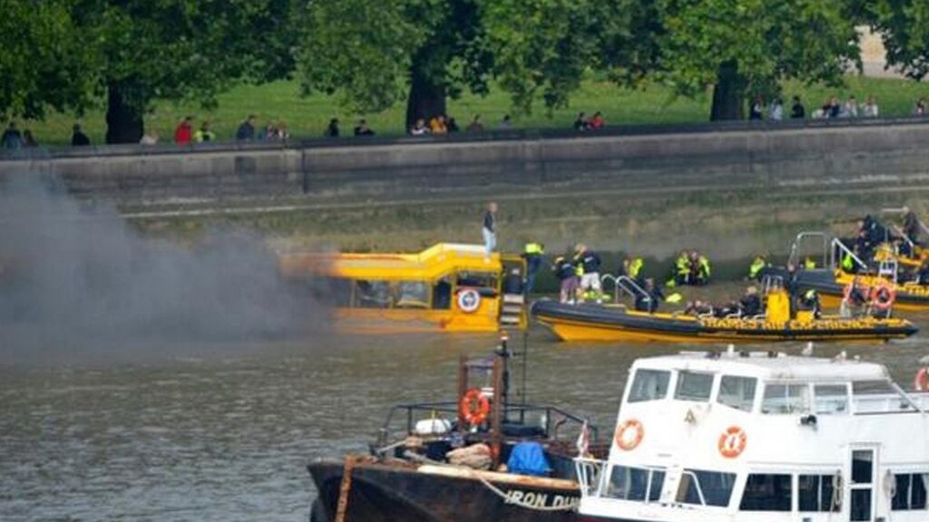 Emergency services attend to a tourist boat after it caught fire on the River Thames, in central London. Photograph: Phil Beasley-Harling/Reuters