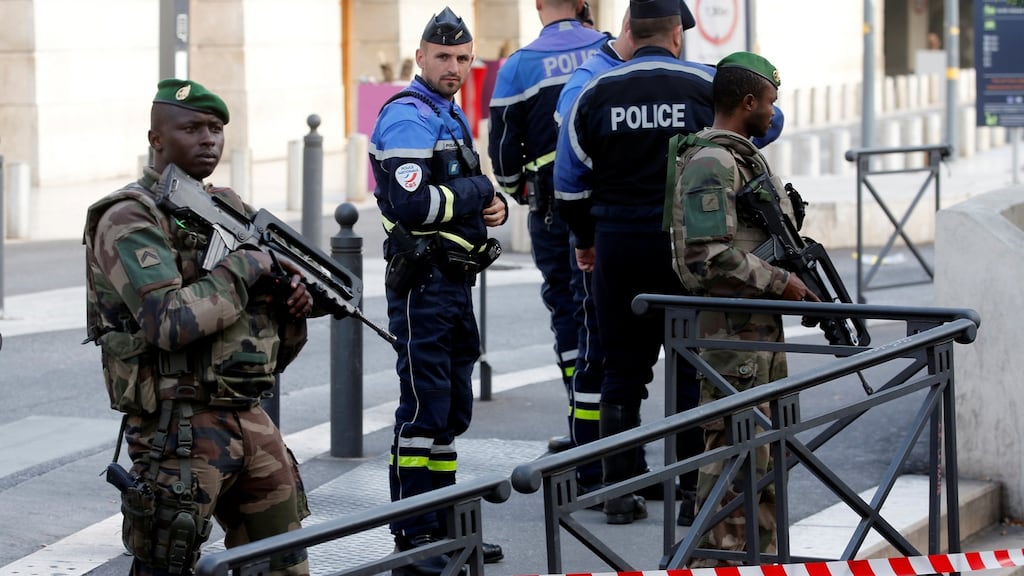 French police and soldier secure a street near the Saint-Charles train station in Marseilles. Photograph: Jean-Paul Pelissier/Reuters