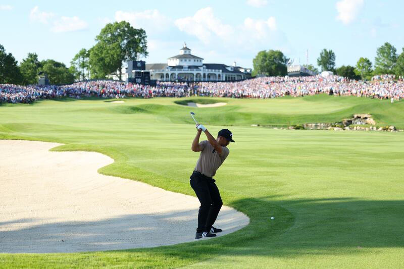 Xander Schauffele of the United States plays an approach shot from the 18th hole. Photograph: Andrew Redington/Getty