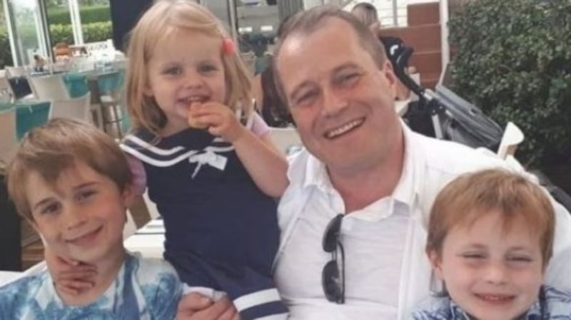 Conor (9), Carla (3) and Darragh McGinley (7) with their father Andrew McGinley. Photograph: An Garda Síochána