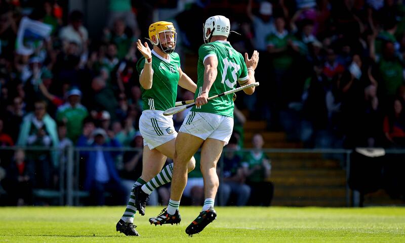 Limerick’s Seamus Flanagan celebrates scoring the first goal of the game with Aaron Gillane. Photograph: Ryan Byrne/Inpho