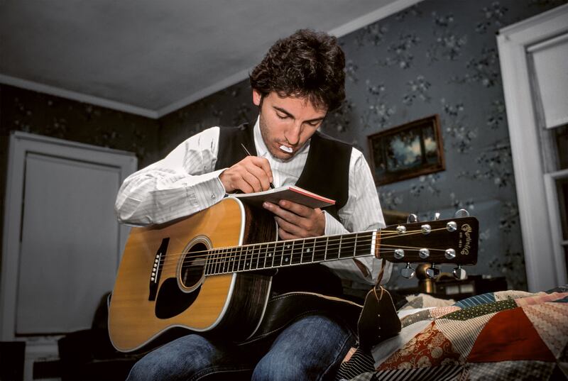 Darkness on the Edge of Town: Bruce Springsteen writing a song with his Martin guitar in 1978. Photograph © Lynn Goldsmith