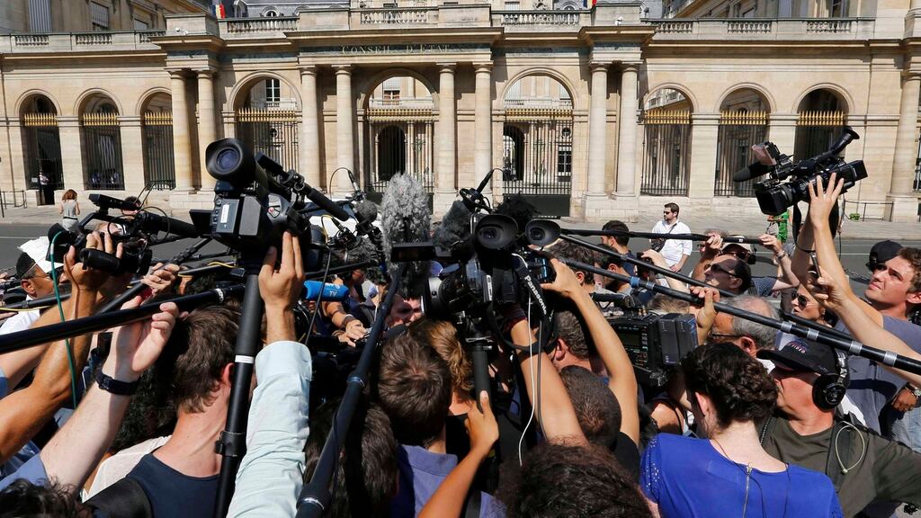 Media outside the Conseil d’État after the court suspended a ban on full-body burkini swimsuits. Photograph: Regis Duvignau/Reuters