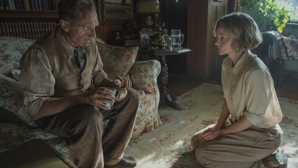 Ralph Fiennes and Carey Mulligan. Fiennes, speaking with a Suffolk burr,  is utterly convincing as the humble bicycling antiquarian. Photograph: Larry Horricks/Netflix ©