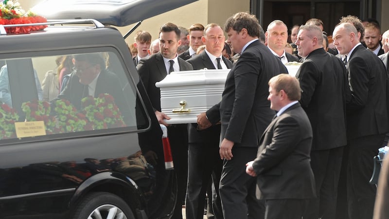 Members of the McGlynn family carrying the coffin of Seán Martin Wilson McGlynn from the church. Photograph: Conor McKeown