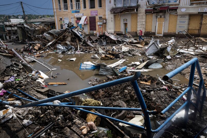 Rainwater fills a Russian bomb crater in the frontline town of Bakhmut, Ukraine. Photograph: David Guttenfelder/The New York Times