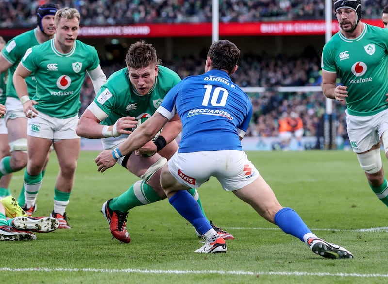 Ireland’s Joe McCarthy is tackled by Paolo Garbisi of Italy. Photograph: Dan Sheridan/Inpho