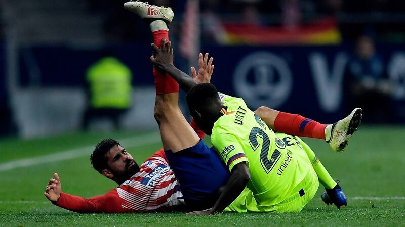 Diego Costa clashes with Samuel Umtiti. Photo: Oscar del Pozo/Getty Images