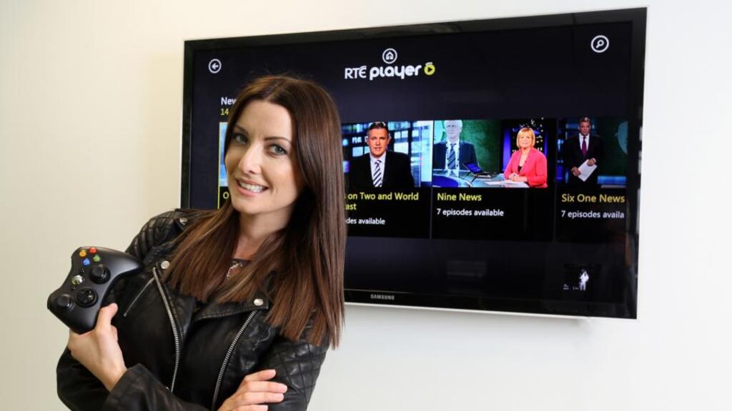 ‘Republic of Telly’ presenter Jennifer Maguire poses with an Xbox 360 controller as the screen behind shows the RTÉ Player interface.