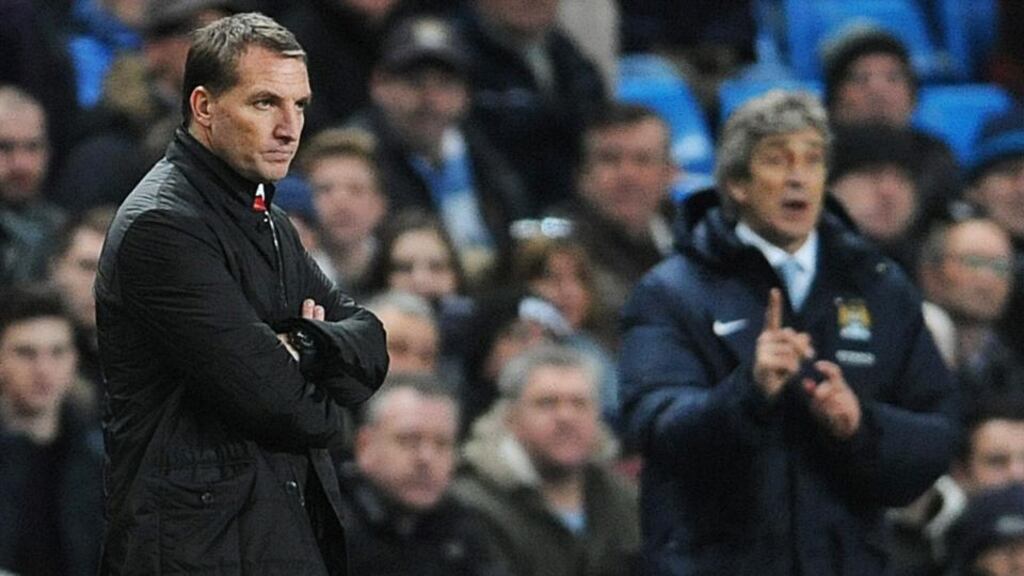 Liverpool’s manager Brendan Rodgers his Manchester City counterpart Manuel Pellegrini watch last night’s match. Photograph: Peter Powell/EPA