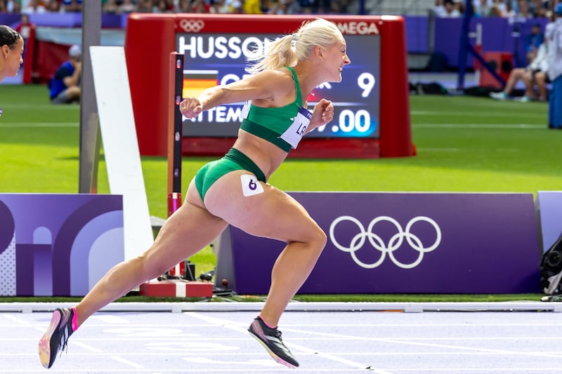 Ireland’s Sarah Lavin finishes second in her heat of the 100m hurdles at the Stade de France. Photograph: Morgan Treacy/Inpho