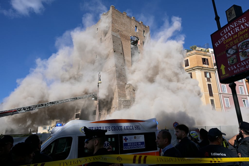 Dust rises following a second collapse of part of the medieval tower Torre dei Conti near the Roman Forum in the historic centre of Rome. Photograph: Tiziana Fabi/ AFP via Getty Images
