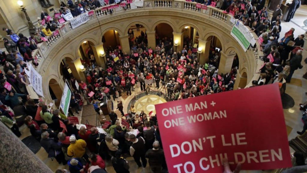 Opponents of a bill to legalise gay marriage in Minnesota gathered in the State Capitol, Rotunda, to voice their opposition. Photograph: AP/Jim Mone