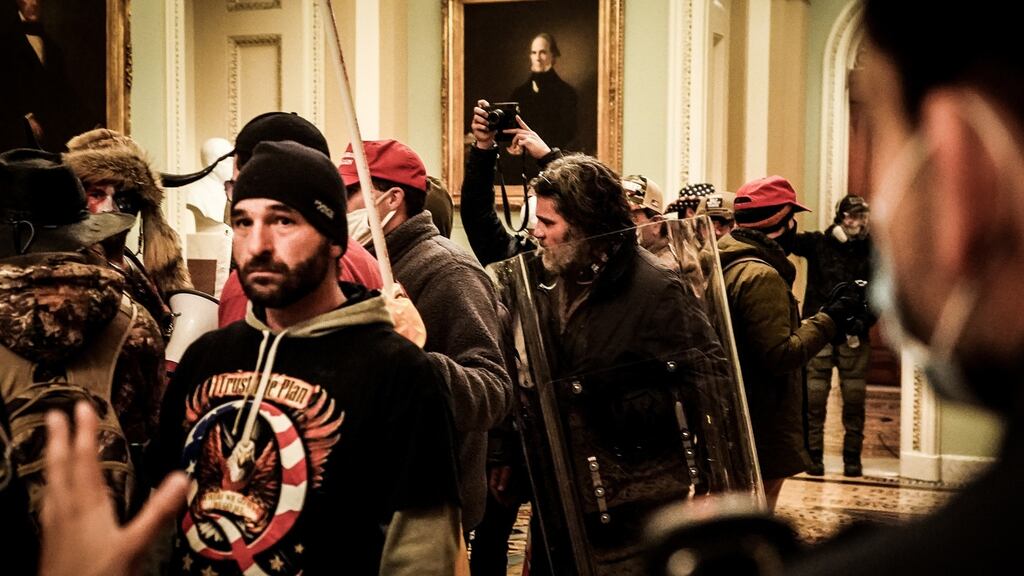 The Proud Boys confront police officers inside the Capitol in Washington on January 6th, 2021. Photograph: Erin Schaff/The New York Times