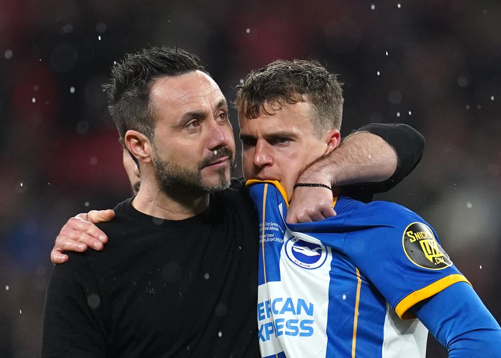 Roberto De Zerbi consoles Solly March after a penalty that was off target but on trend. Photograph: Nick Potts/PA