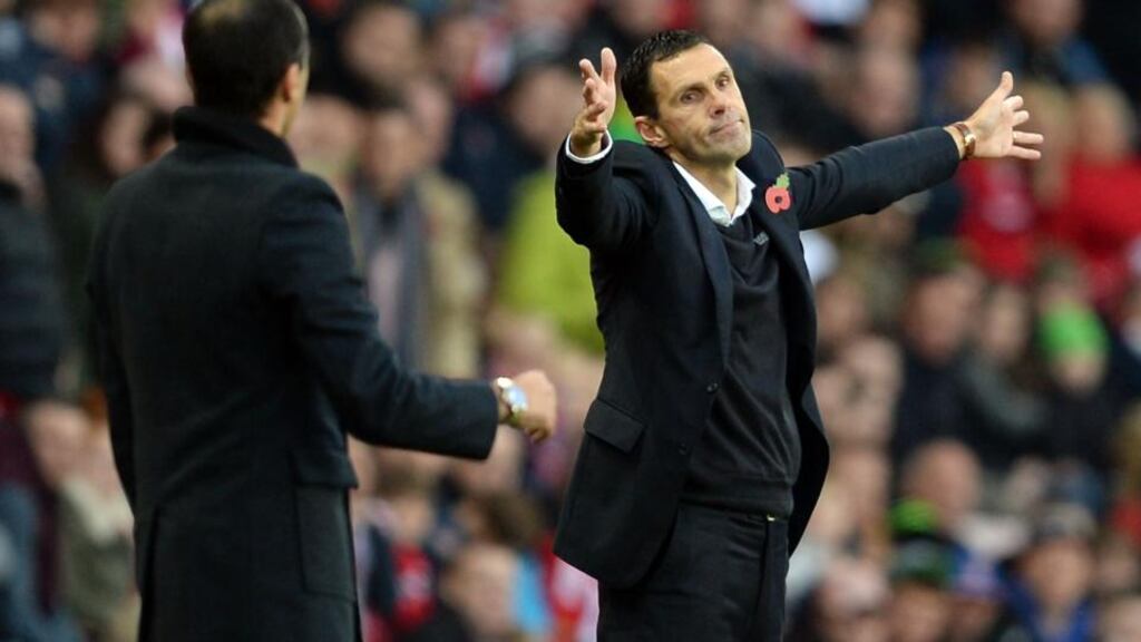 Sunderland manager Gus Poyet and Everton manager Roberton Martínez on the sideline at the Stadium of Light. Photograph: Nigel Roddis/Getty Images