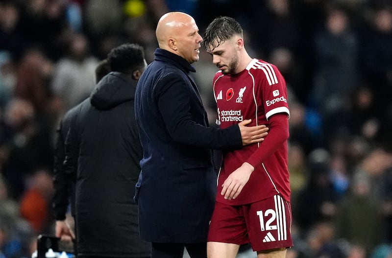 Liverpool manager Arne Slot (left) shakes hands with player Liverpool's Conor Bradley. Photograph: Nick Potts/PA