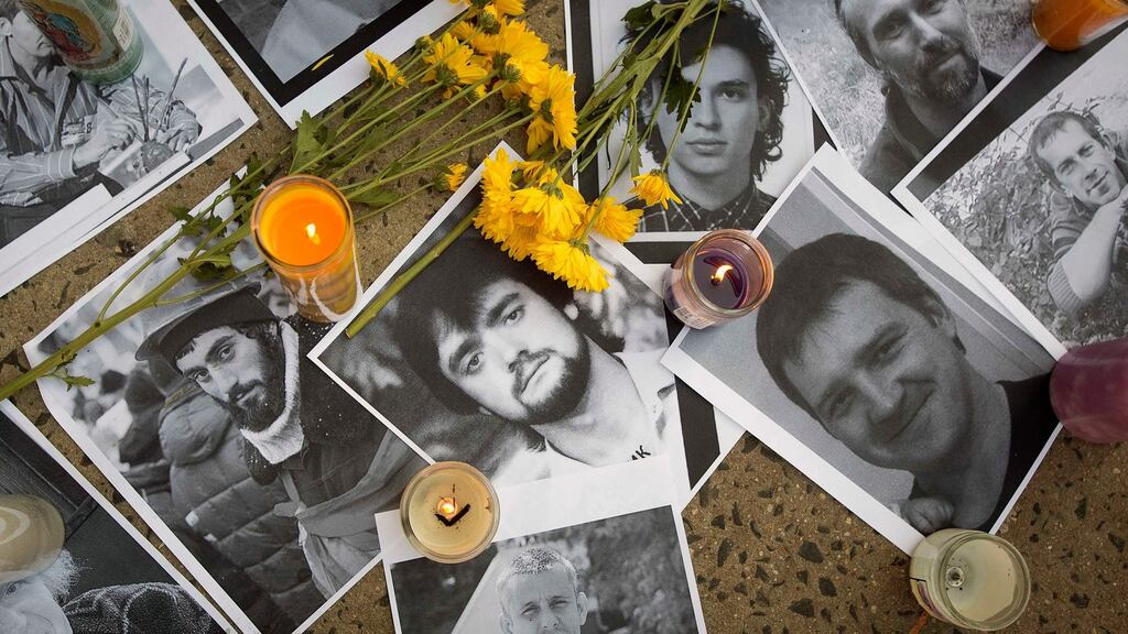 Photos of people reported to have died during clashes in Kiev at a makeshift memorial in the Little Ukraine section of the Manhattan borough of New York. Photograph: Carlo Allegri/Reuters