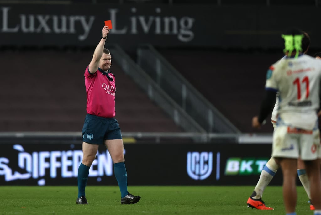 Referee Eoghan Cross showing a red card. Photograph: Bryan Keane/Inpho