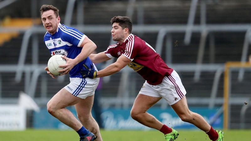 Gary Walsh of Laois with John Egan of Westmeath. Photograph: Inpho/Tommy Dickson