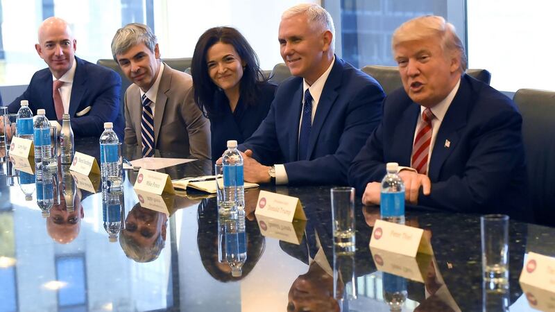 Jeff Bezos, Larry Page of Alphabet and Facebook’s Sheryl Sandberg attend a meeting with vice president-elect Mike Pence and president-elect Donald Trump prior to Trump's first term in the White House. Photograph: Timothy A Clary/AFP/Getty