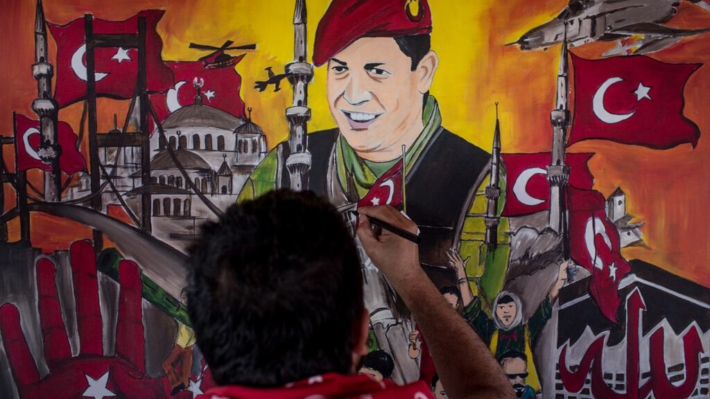 Taksim Square: a man puts the finishing touches on a painting depicting Turkey’s attempted coup of July 15th, 2016. Photograph: Chris McGrath/Getty
