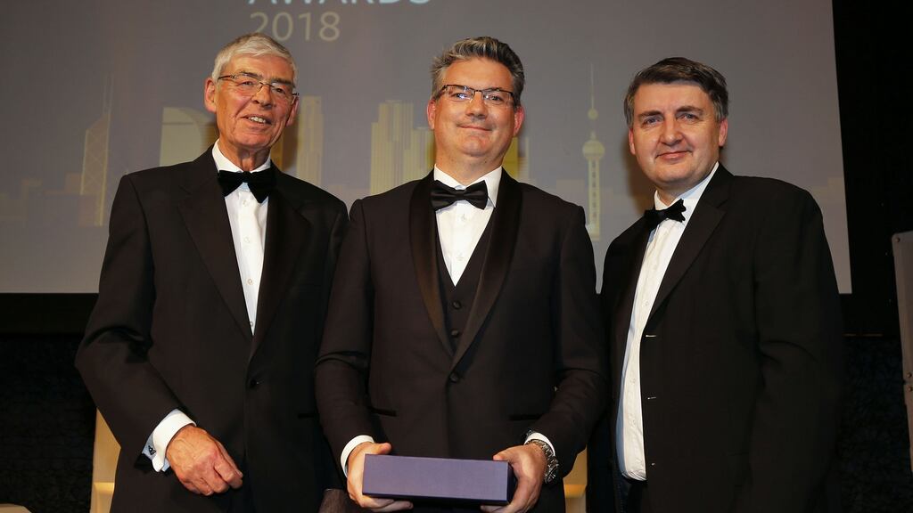 Edmond Scanlon (centre) receives the lifetime achievement award on behalf of Kerry Group at the Asia Matters Business Awards in Dublin, presented by Asia Matters chairman Alan Dukes (left) and Martin Murray, its executive director. Photograph: Nick Bradshaw