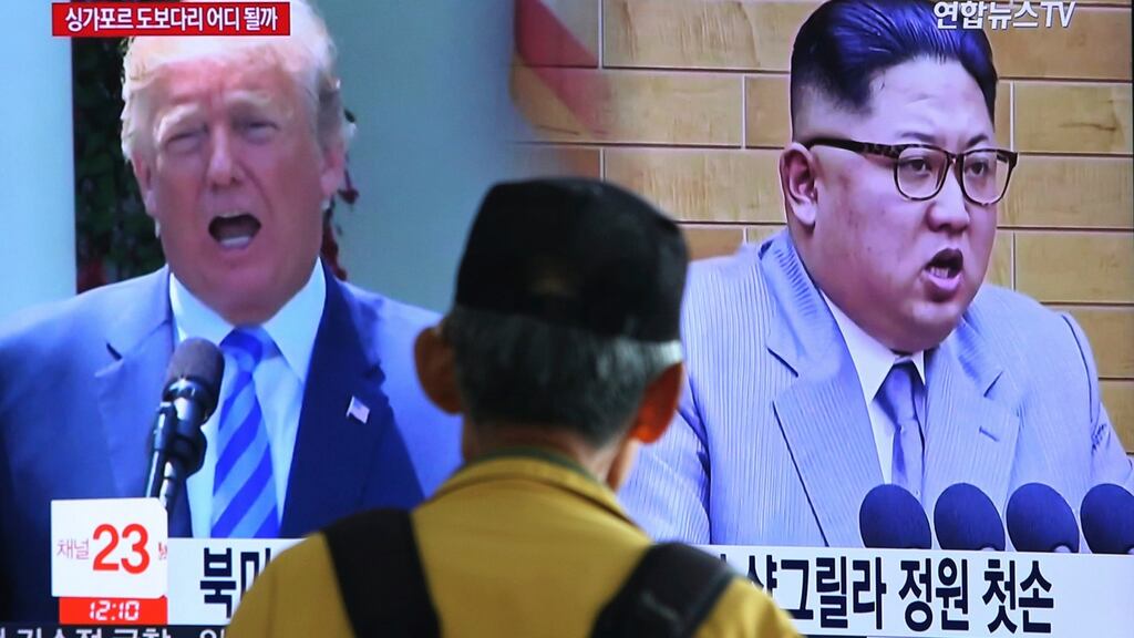 A man watches a TV screen showing file footage of US president Donald Trump (left), and North Korean leader Kim Jong-un  at the Seoul Railway Station in Seoul, South Korea. Photograph: Ahn Young-joon/AP Photo